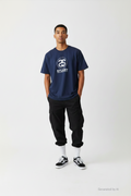 T-shirt Stüssy World Tour bleu marine S face — logo 5 villes NYC LA Tokyo Londres Paris — seconde main vintage — Epok Label